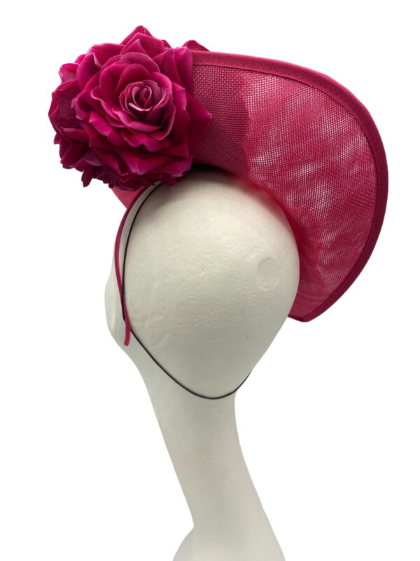 Medium size pink headpiece on a headband, finished with flower detail.